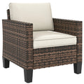 Fauteuil de jardin en résine tressée, avec accoudoirs et coussins, pour balcon, véranda ou terrasse, couleur blanc crème.